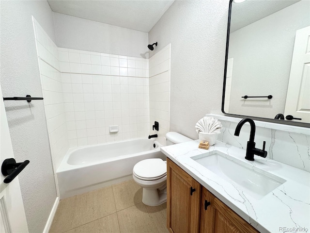 12743 W Bowles Pl, Littleton, CO 80127 - full bath featuring a textured wall, toilet, vanity, and shower / bathtub combination