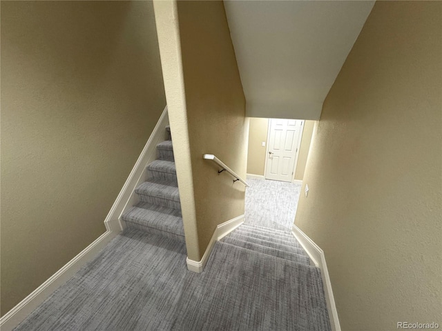 12743 W Bowles Pl, Littleton, CO 80127 - stairway featuring baseboards, carpet, and vaulted ceiling
