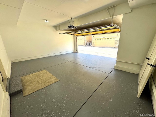 12743 W Bowles Pl, Littleton, CO 80127 - garage featuring a garage door opener