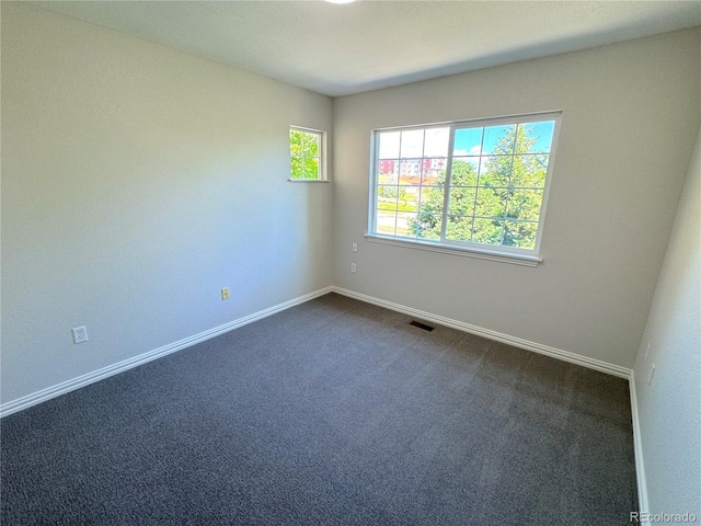 12743 W Bowles Pl, Littleton, CO 80127 - unfurnished room with dark carpet and baseboards