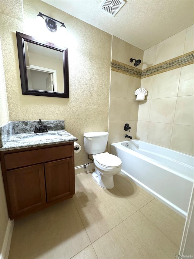 12743 W Bowles Pl, Littleton, CO 80127 - full bath featuring shower / bath combination, toilet, vanity, a textured ceiling, and tile patterned floors