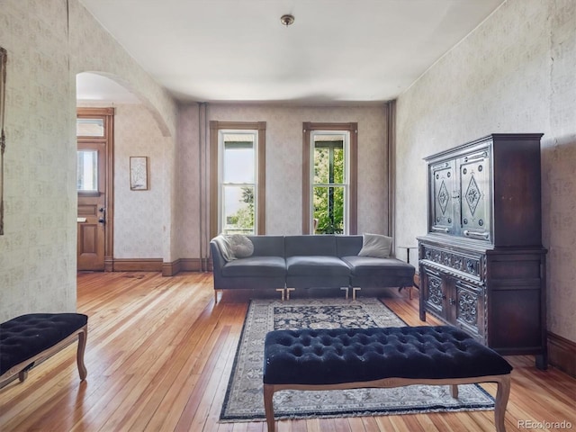 3 S Newton St, Denver, CO 80219 - living room with arched walkways and hardwood / wood-style floors