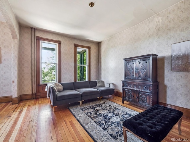 3 S Newton St, Denver, CO 80219 - living area featuring wood-type flooring and wallpapered walls