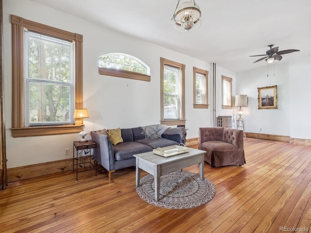 3 S Newton St, Denver, CO 80219 - living area with hardwood / wood-style flooring, ceiling fan, and a chandelier