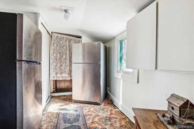 3 S Newton St, Denver, CO 80219 - kitchen featuring freestanding refrigerator and lofted ceiling