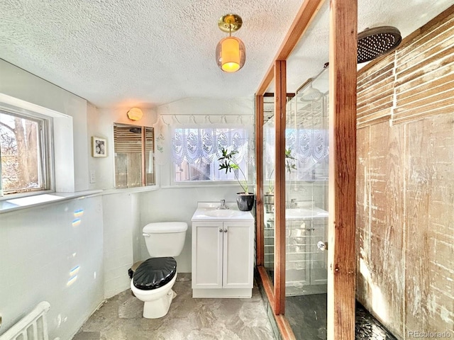 3 S Newton St, Denver, CO 80219 - full bathroom with healthy amount of natural light, vanity, a stall shower, and a textured ceiling