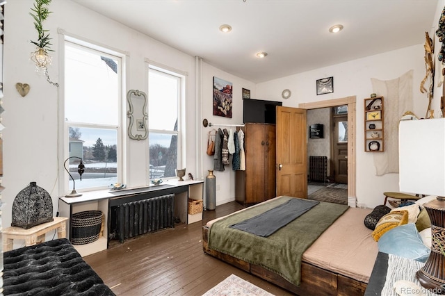 3 S Newton St, Denver, CO 80219 - bedroom with radiator heating unit and wood-type flooring
