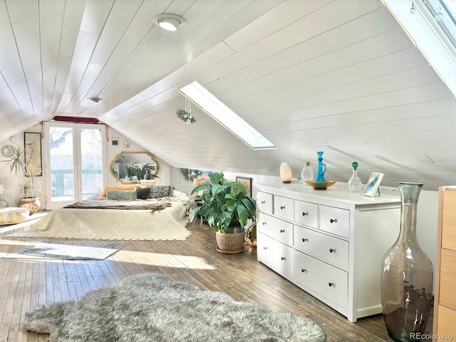 3 S Newton St, Denver, CO 80219 - bedroom with hardwood / wood-style flooring, vaulted ceiling, and a skylight