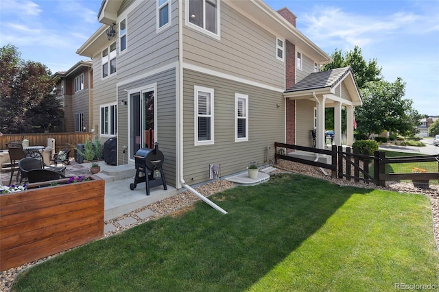 10388 Rutledge St, Parker, CO 80134 - rear view of house with a patio and a chimney