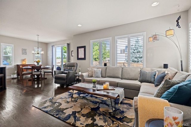 10388 Rutledge St, Parker, CO 80134 - living room with dark wood-type flooring, a chandelier, and recessed lighting