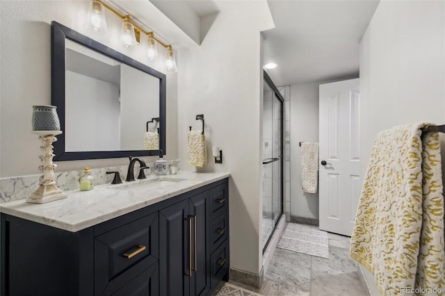 bathroom with vanity and a shower with door