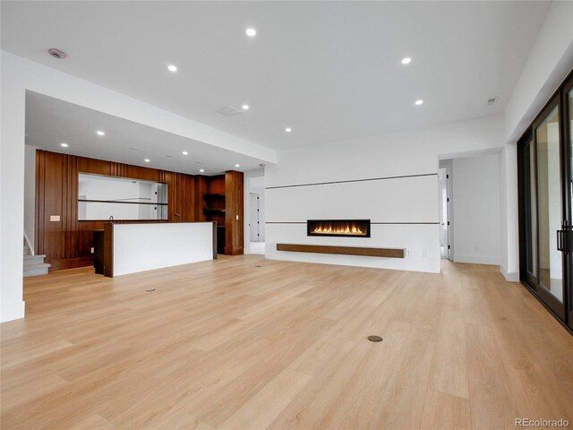 8132 Galileo Way, Littleton, CO 80125 - unfurnished living room featuring light wood-style flooring and recessed lighting