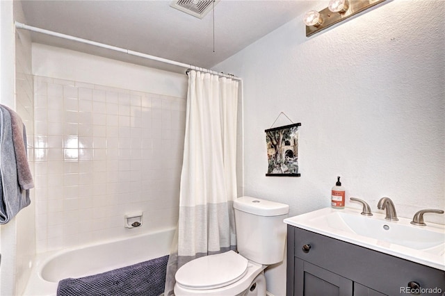 420 Wright St Unit 101, Lakewood, CO 80228 - bathroom with toilet, shower / tub combo, a textured wall, and vanity