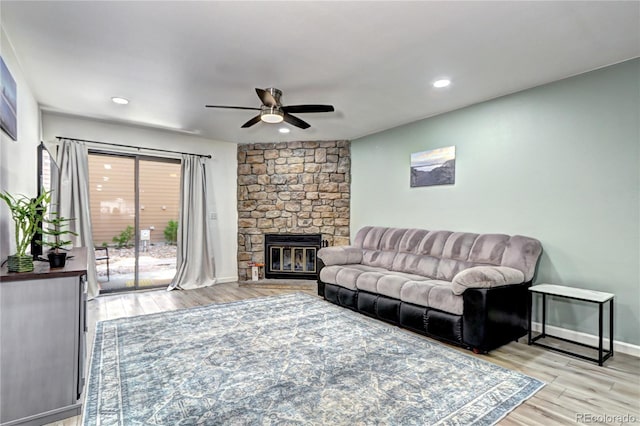 420 Wright St Unit 101, Lakewood, CO 80228 - living area featuring ceiling fan, a stone fireplace, light wood-type flooring, and recessed lighting