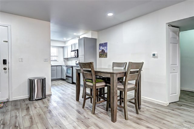 420 Wright St Unit 101, Lakewood, CO 80228 - dining room with light wood finished floors and recessed lighting