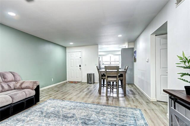 420 Wright St Unit 101, Lakewood, CO 80228 - living room featuring wood finished floors and recessed lighting