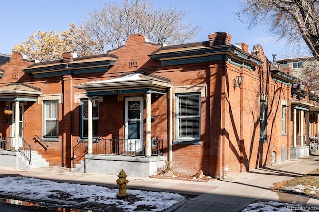 view of front of home featuring brick siding