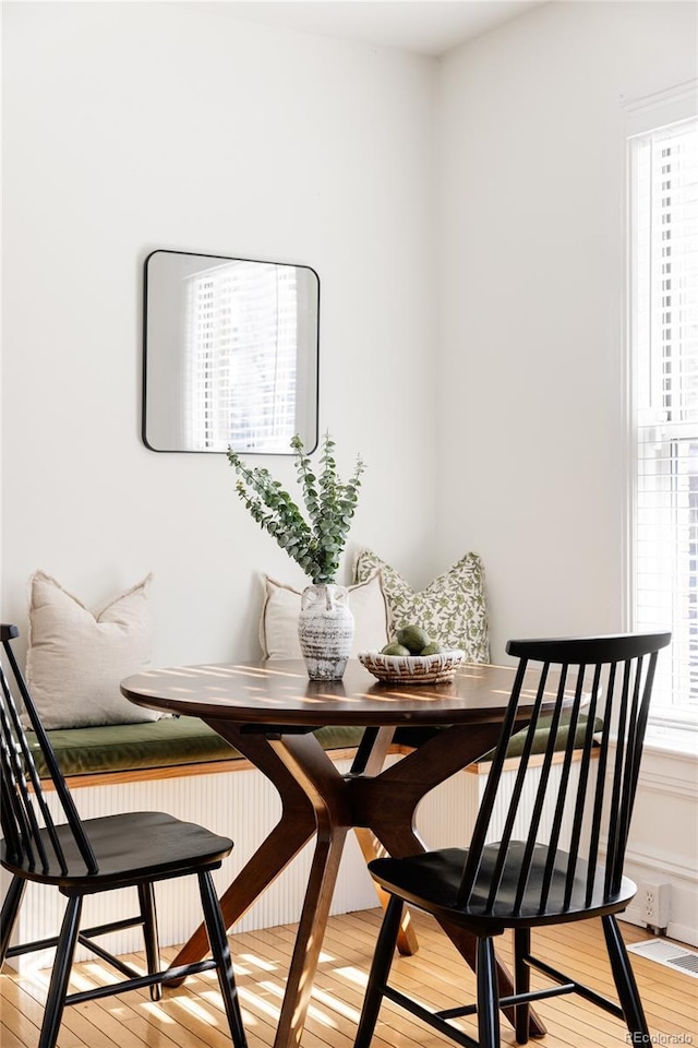 dining space with breakfast area and light wood-type flooring