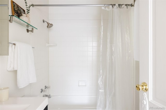 bathroom with shower / bath combo with shower curtain and vanity