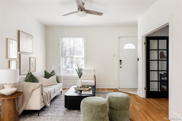 1000 N Ogden St, Denver, CO 80218 - living room with light wood-type flooring, ceiling fan, and baseboards