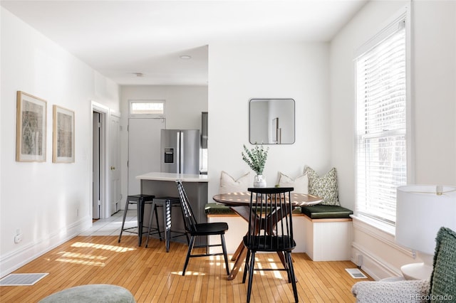 1000 N Ogden St, Denver, CO 80218 - dining area featuring light wood-style flooring and baseboards