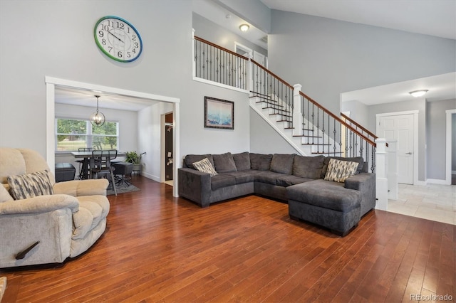 living room featuring hardwood / wood-style floors and high vaulted ceiling