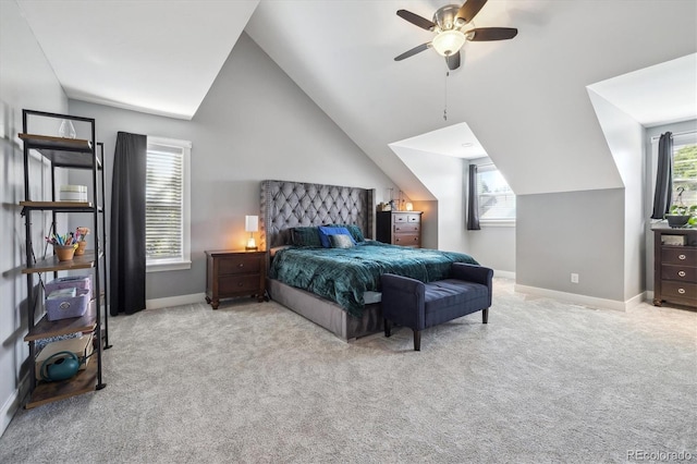 bedroom with light colored carpet, lofted ceiling, and multiple windows