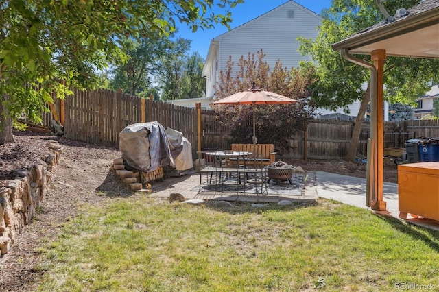 view of yard with a patio and a fire pit