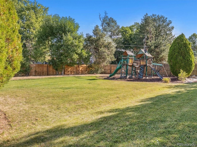 view of jungle gym with a lawn