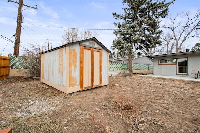 view of shed featuring a fenced backyard