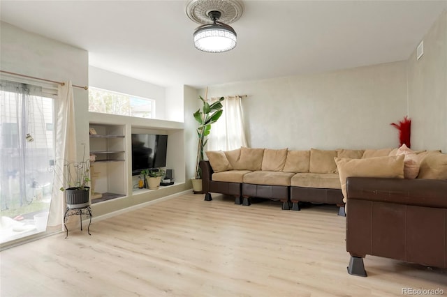 20292 E 47th Ave, Denver, CO 80249 - living area featuring visible vents and light wood finished floors