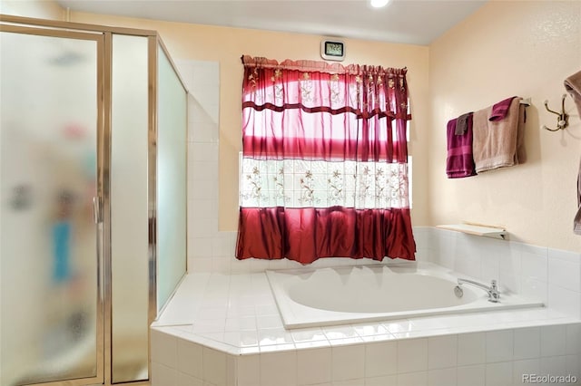 20292 E 47th Ave, Denver, CO 80249 - full bathroom featuring a bath and a stall shower