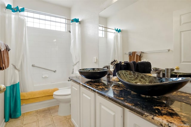 20292 E 47th Ave, Denver, CO 80249 - full bath featuring double vanity, toilet, a sink, and shower / bath combo with shower curtain