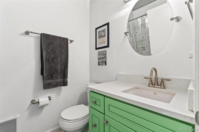 bathroom featuring vanity, toilet, curtained shower, and mail boxes