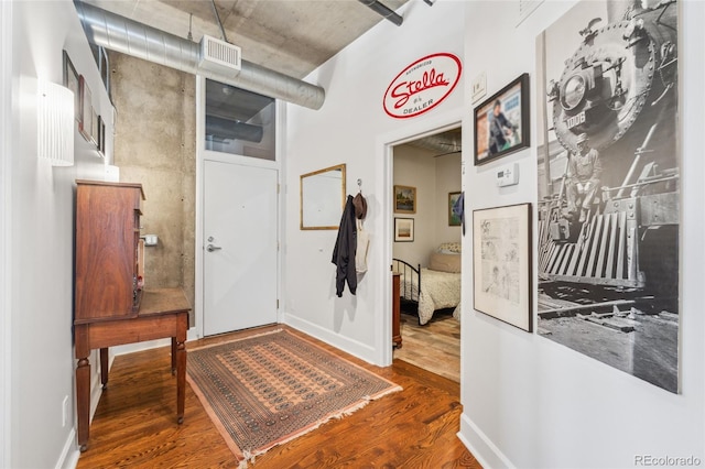 entryway with wood-type flooring