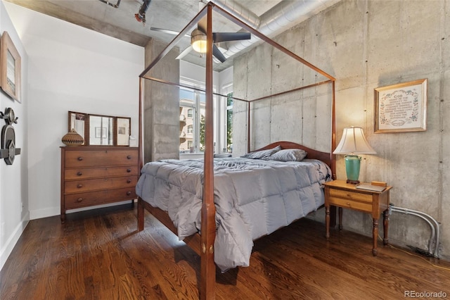 bedroom featuring ceiling fan and dark hardwood / wood-style flooring