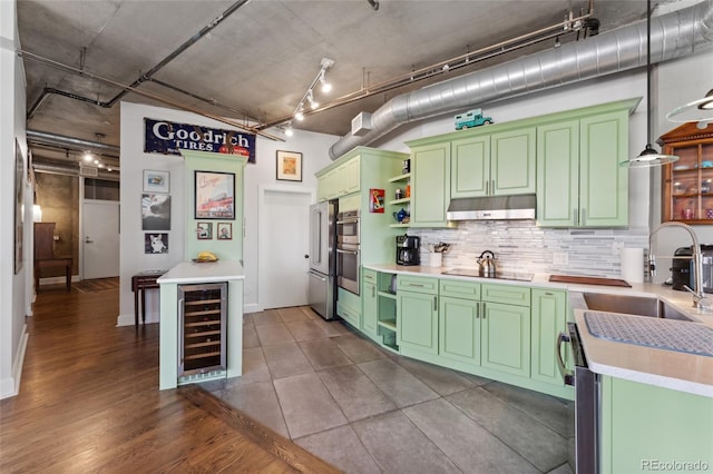 kitchen featuring green cabinetry, open shelves, beverage cooler, decorative backsplash, and under cabinet range hood