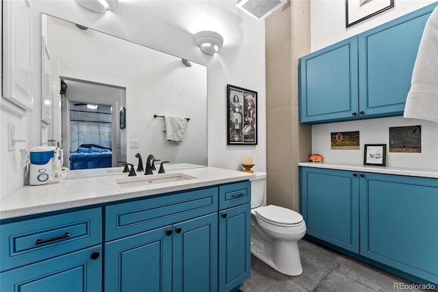 290 W 12th Ave Unit 303, Denver, CO 80204 - bathroom with vanity, tile patterned floors, toilet, and ensuite bath