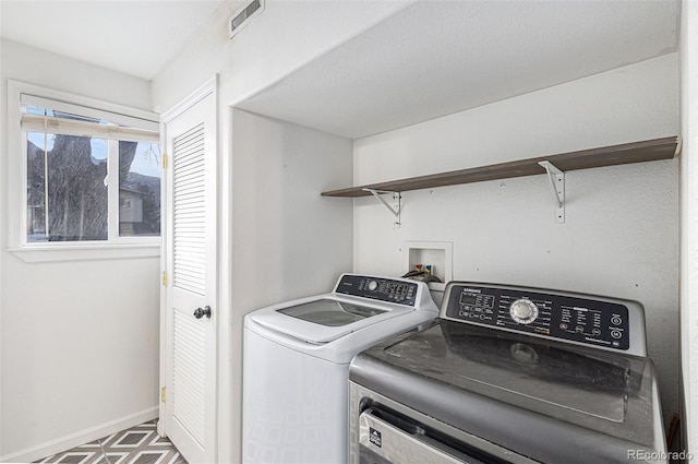 laundry room featuring washer and dryer