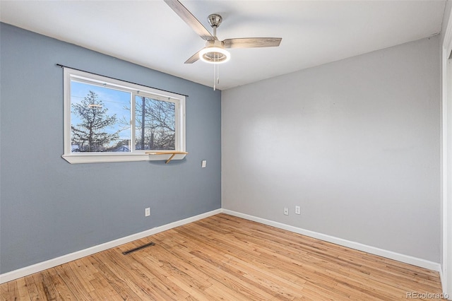 spare room with light hardwood / wood-style floors and ceiling fan