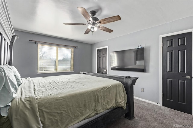 carpeted bedroom with ceiling fan and baseboards