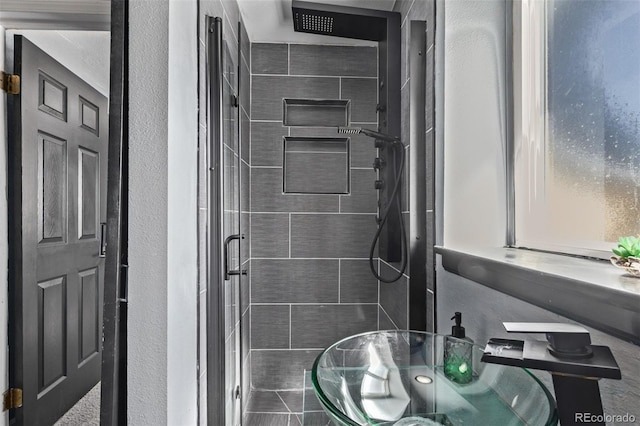 bathroom with a shower stall