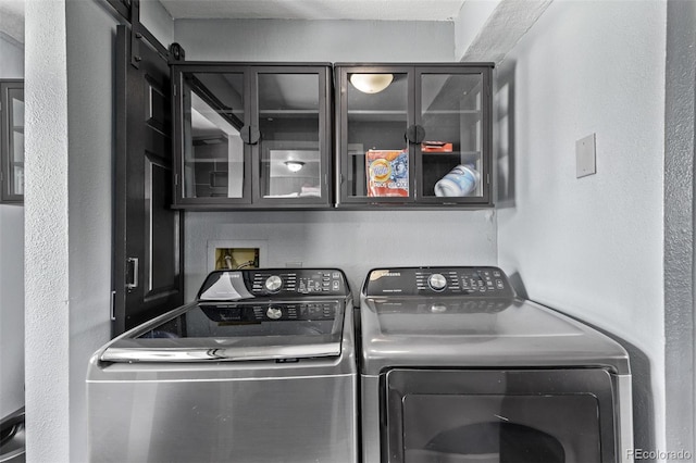 laundry area featuring laundry area and washing machine and dryer