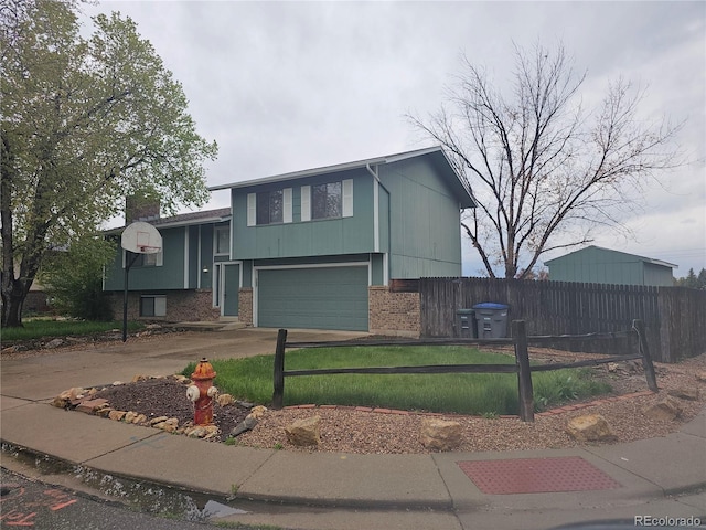 880 Orion Dr, Lafayette, CO 80026 - raised ranch featuring brick siding, driveway, and a garage