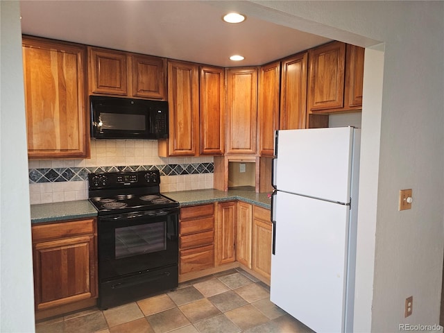 880 Orion Dr, Lafayette, CO 80026 - kitchen featuring black appliances, dark countertops, backsplash, brown cabinets, and recessed lighting