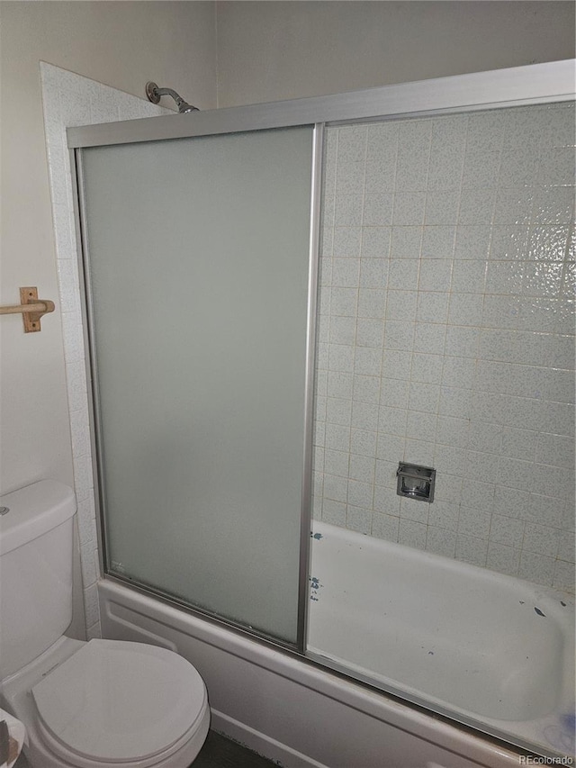 880 Orion Dr, Lafayette, CO 80026 - bathroom featuring toilet and combined bath / shower with glass door