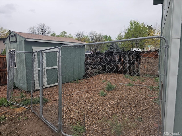 880 Orion Dr, Lafayette, CO 80026 - view of yard with fence, a storage unit, and an outbuilding