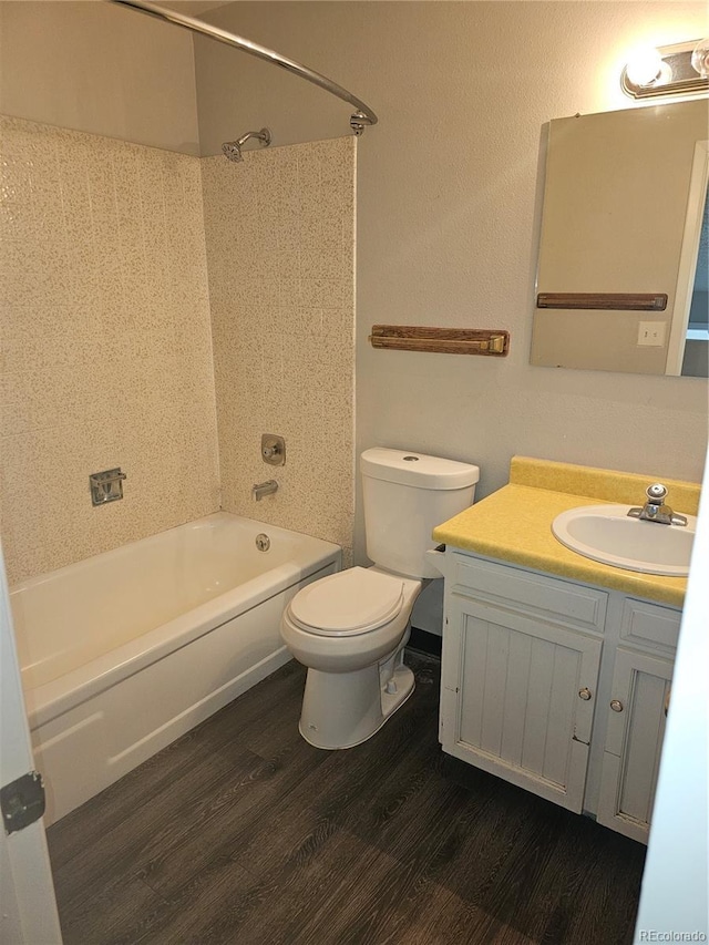880 Orion Dr, Lafayette, CO 80026 - bathroom featuring wood finished floors, shower / washtub combination, vanity, and toilet
