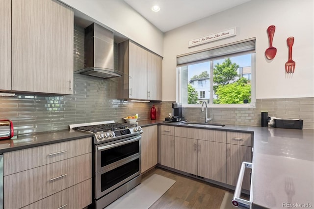 2898 W 22nd Ave, Denver, CO 80211 - kitchen featuring a sink, range with two ovens, wall chimney range hood, decorative backsplash, and light brown cabinetry