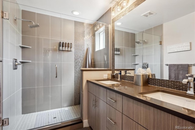 2898 W 22nd Ave, Denver, CO 80211 - bathroom featuring double vanity, a shower stall, and backsplash